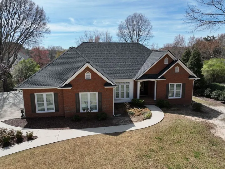 Brick ranch home with new Charcoal UHDZ shingle roof