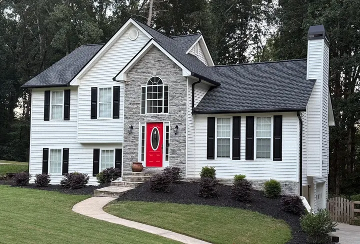 Two-story home with new roof and gutter guard combo