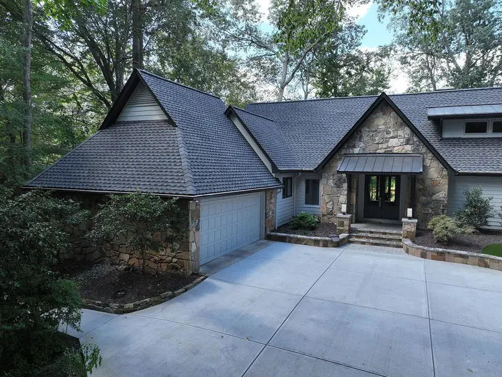 Craftsman home with new dark shingle roof