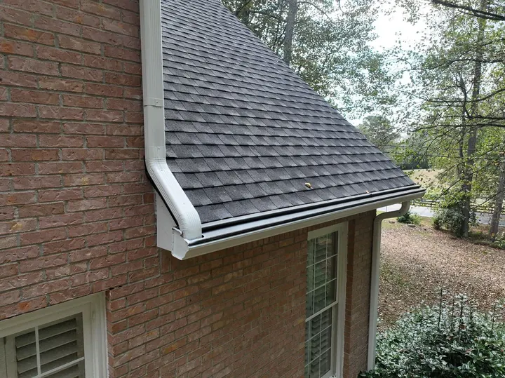Seamless white gutters with gutter guards