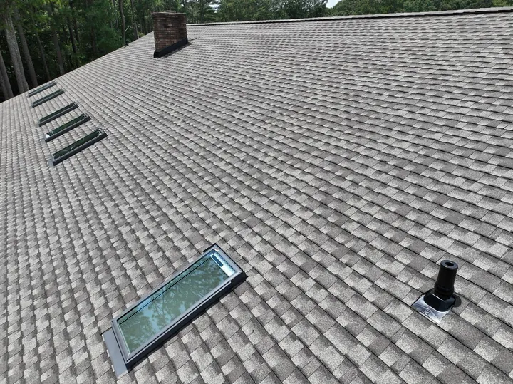 New shingle roof with skylight installation