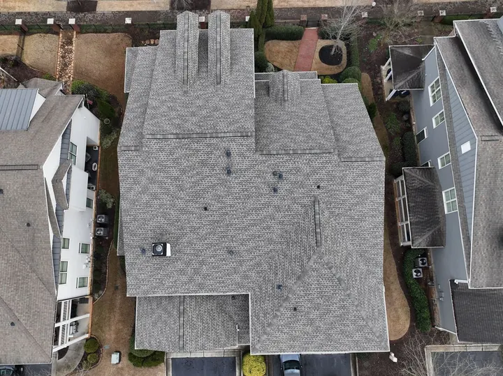 Aerial view of Weathered Wood shingle roof on townhome