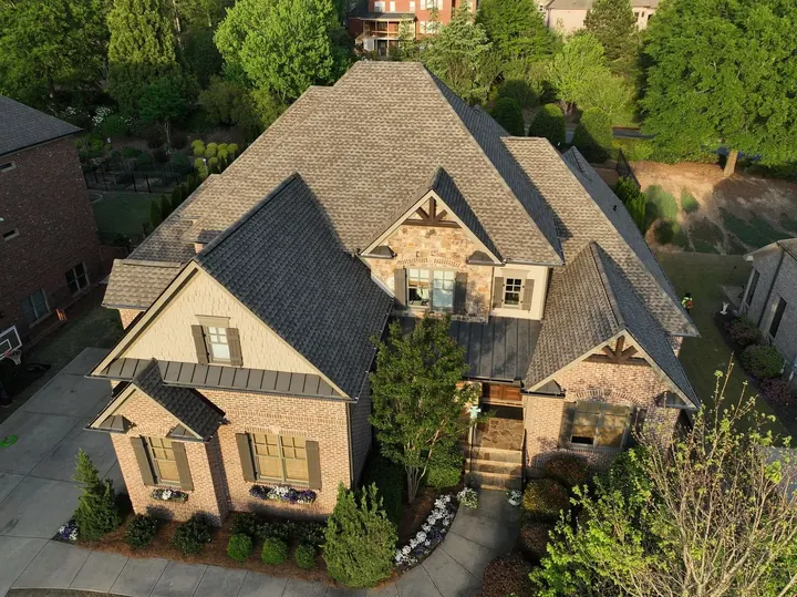 Weathered Wood roof on brick and stone home