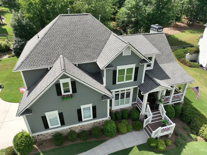 Weathered Wood roof on green two-story home