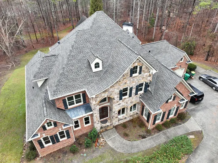 Weathered Wood UHDZ roof on stone and brick home