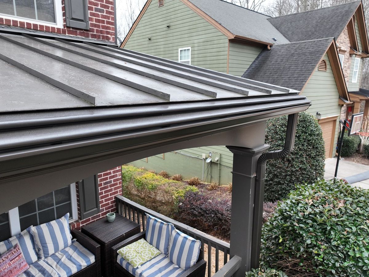Detail of a gutter system around a metal porch roof