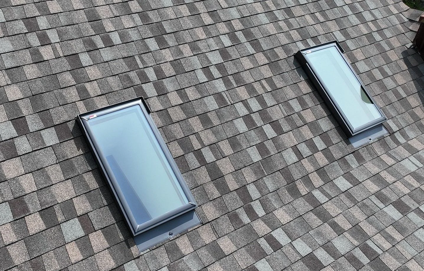 Two VELUX skylights on a shingle roof